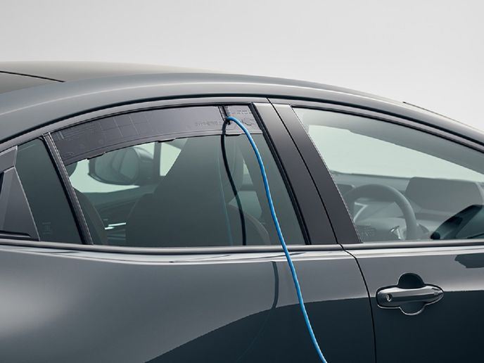 An external electric power supply attachment comes as standard so that external power supply is possible while the door windows are closed to prevent rain and insects from getting in the car.  -  Photo: Toyota