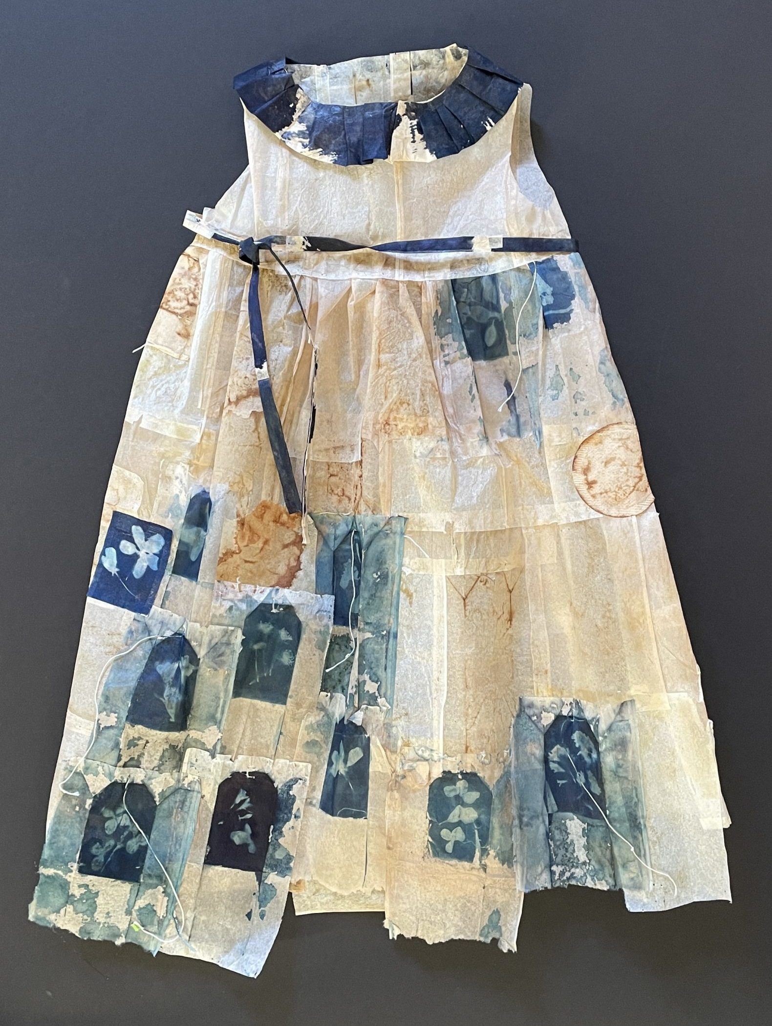 A child's dress made out of tea bags.