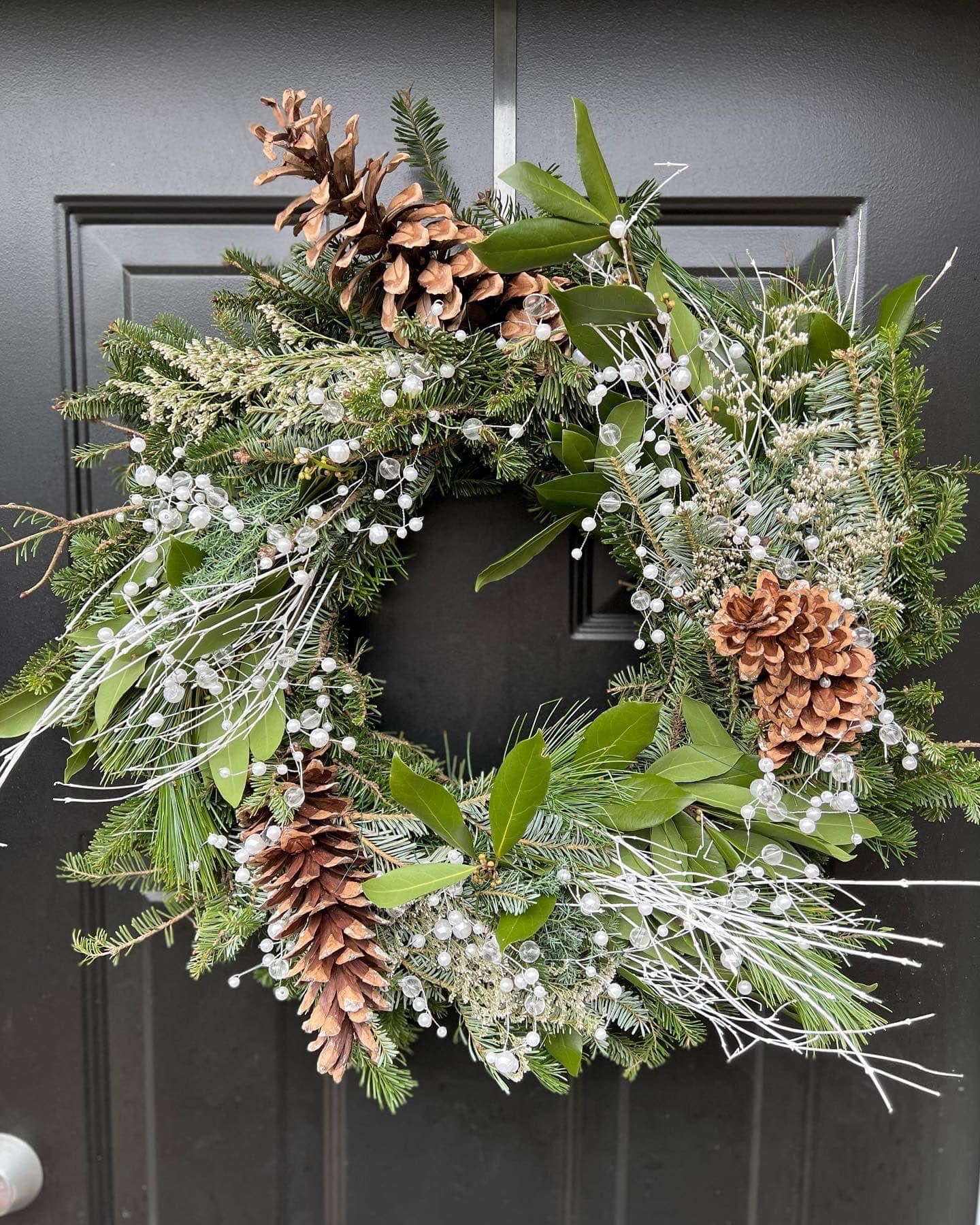 wreath with faux pearls, white branches, and pinecones