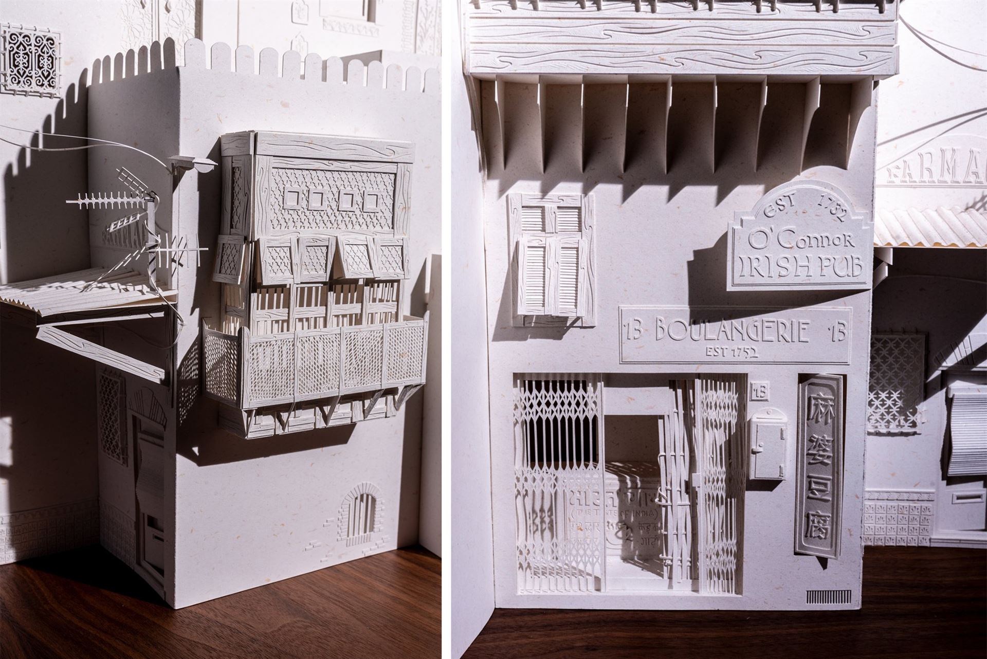 Two images of an architectural sculpture made of paper.