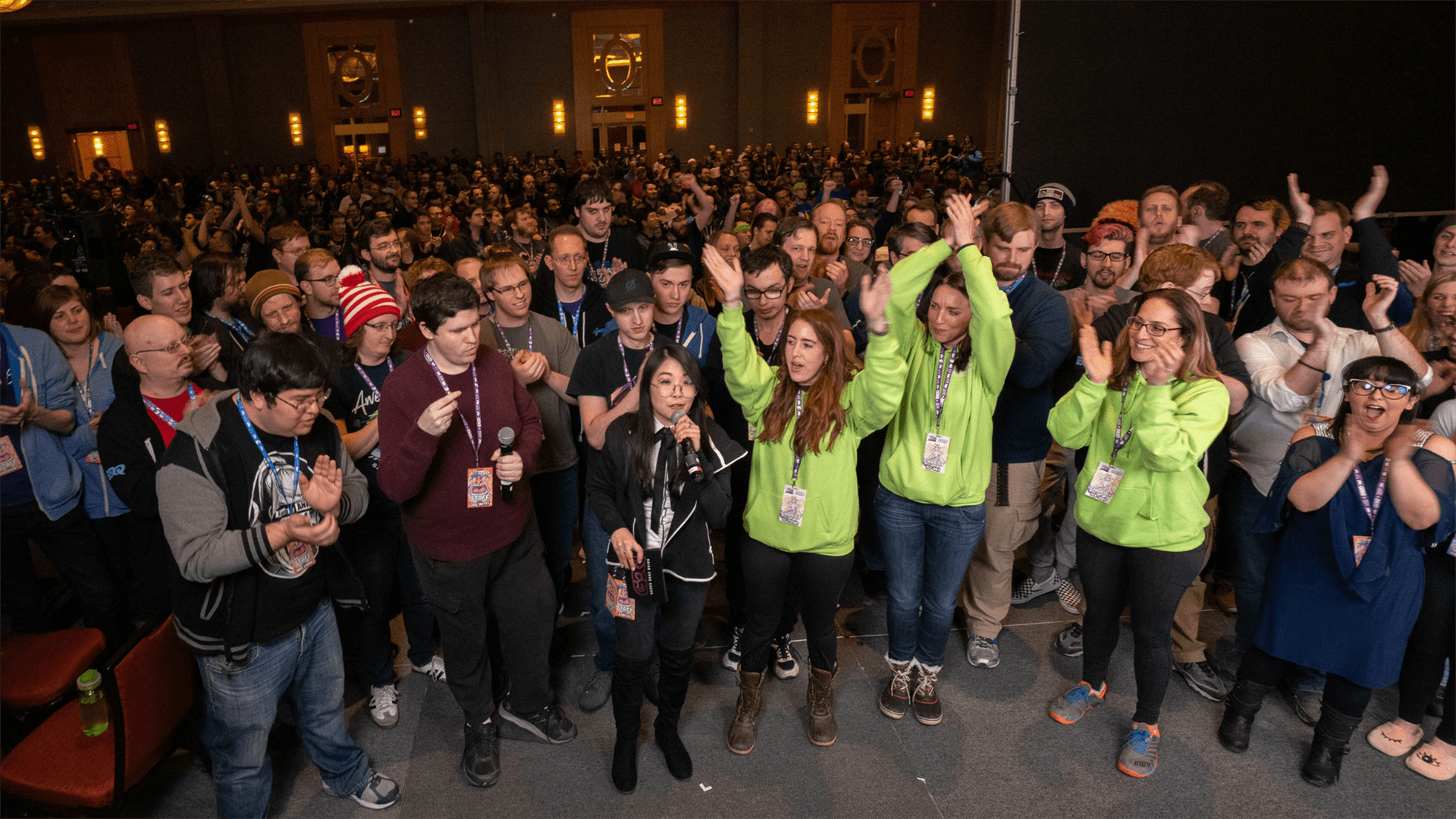 A crowd of people in a hotel ballroom celebrating Games Done Quick 2019