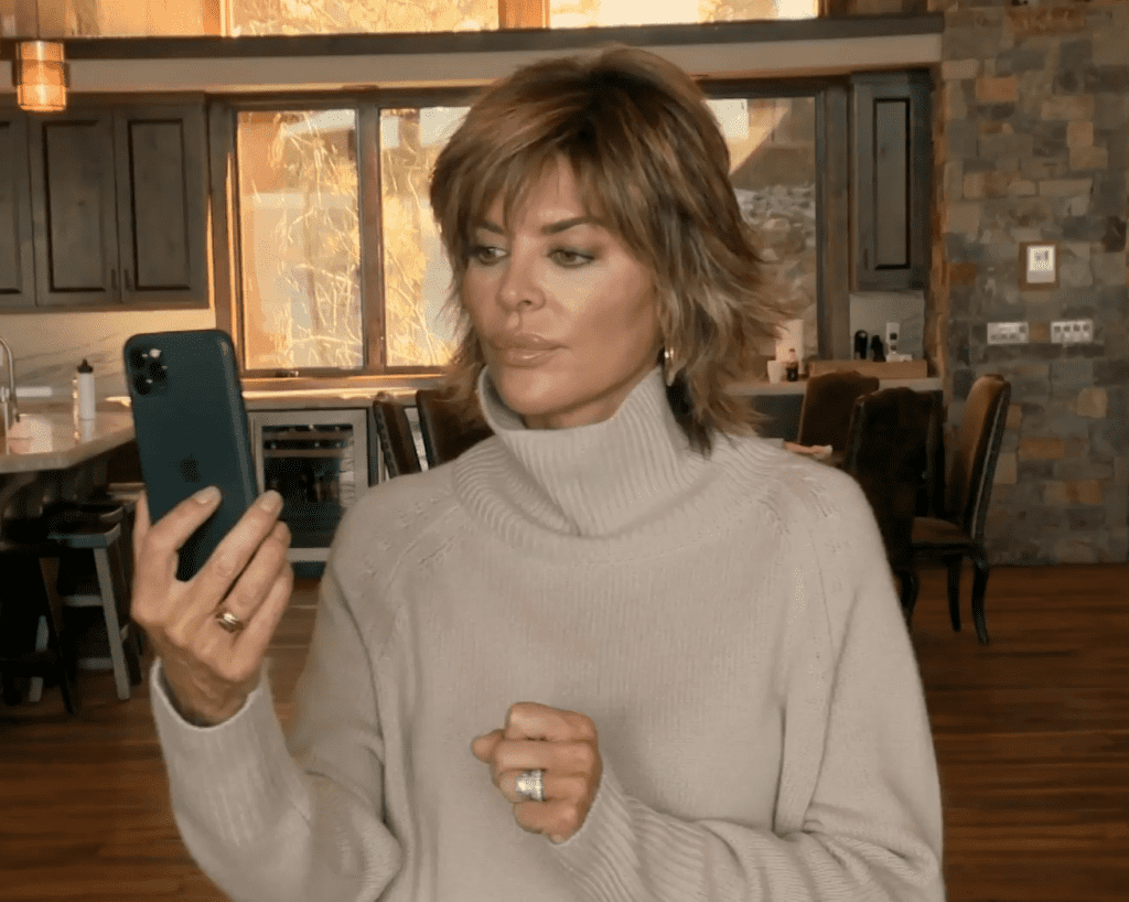 Lisa Rinna Stares at Her Phone Dubiously