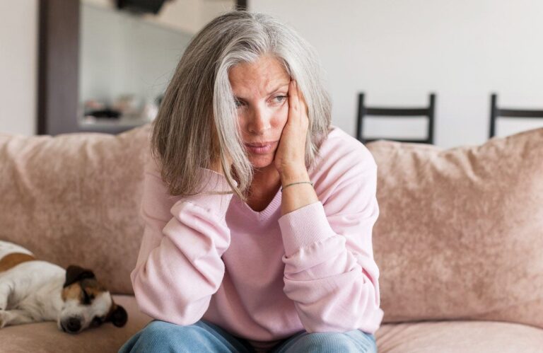 woman sad couch